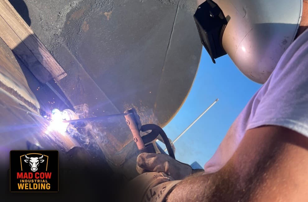 Stick welding on heavy equipment outdoors