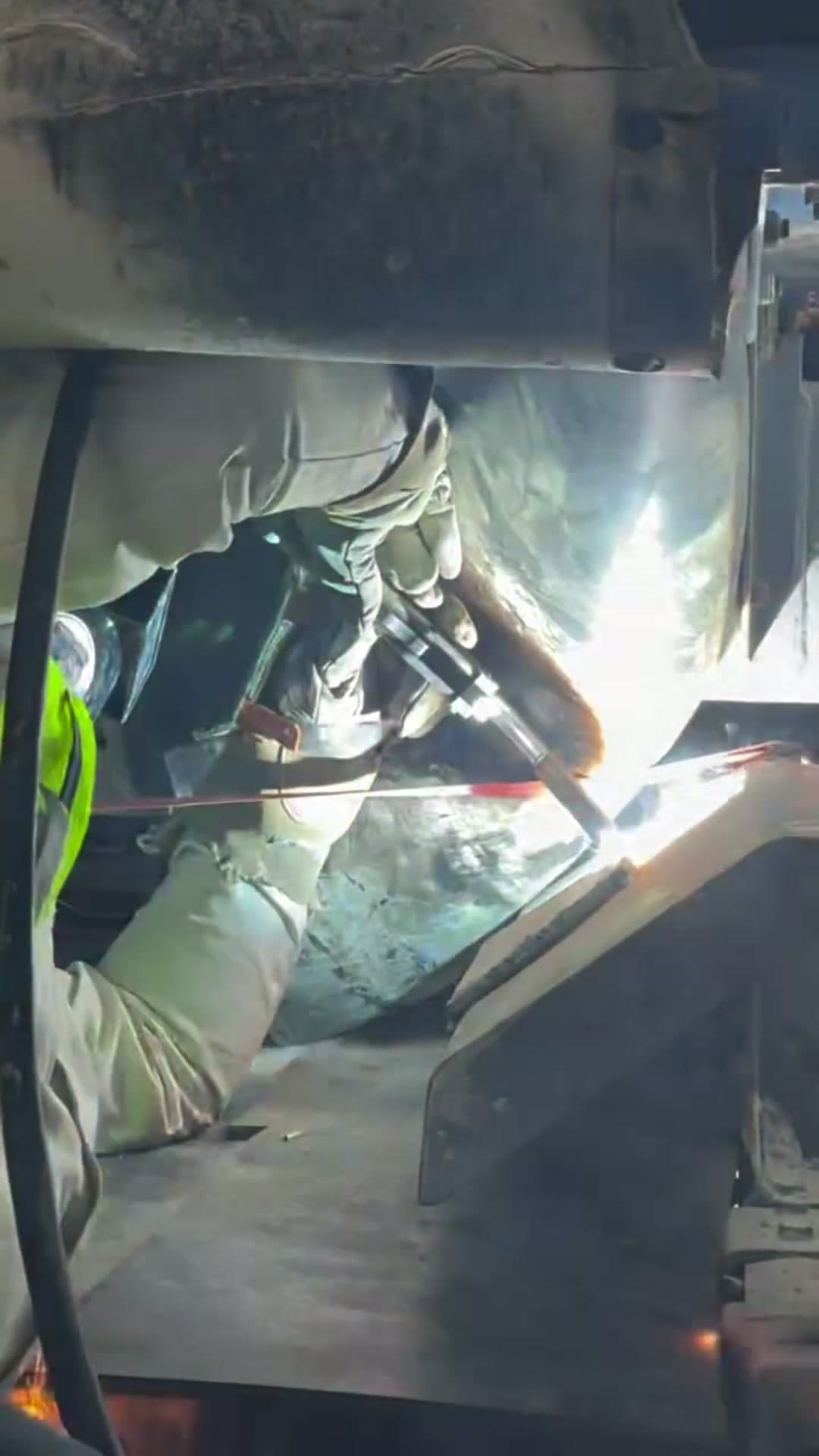 Close-up welding arc on industrial steel
